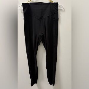 HALARA Black High-Waisted Leggings with Booty Lifting Band.